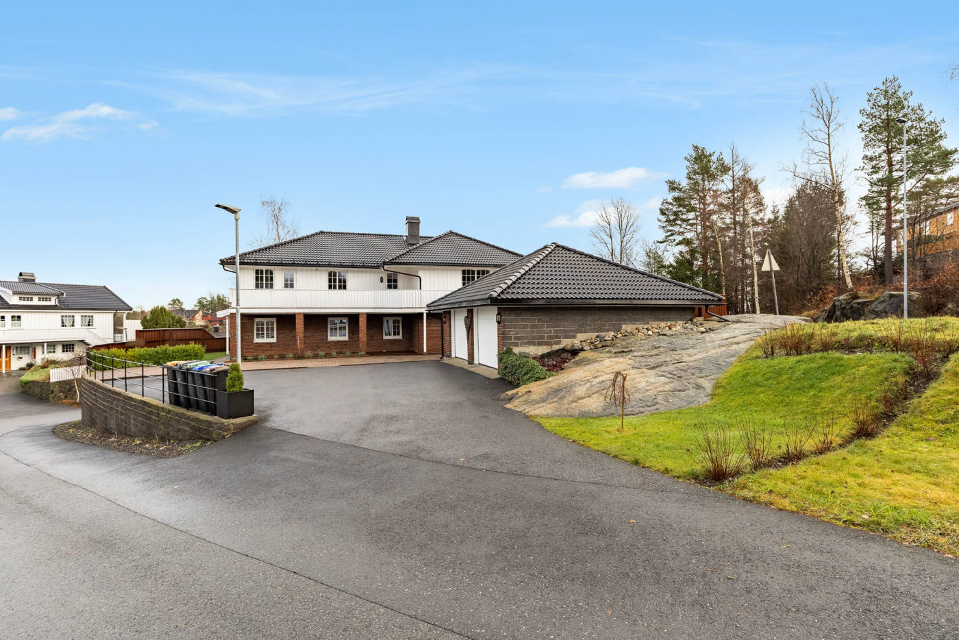 Real estate exterior with vibrant blue sky after professional sky replacement service