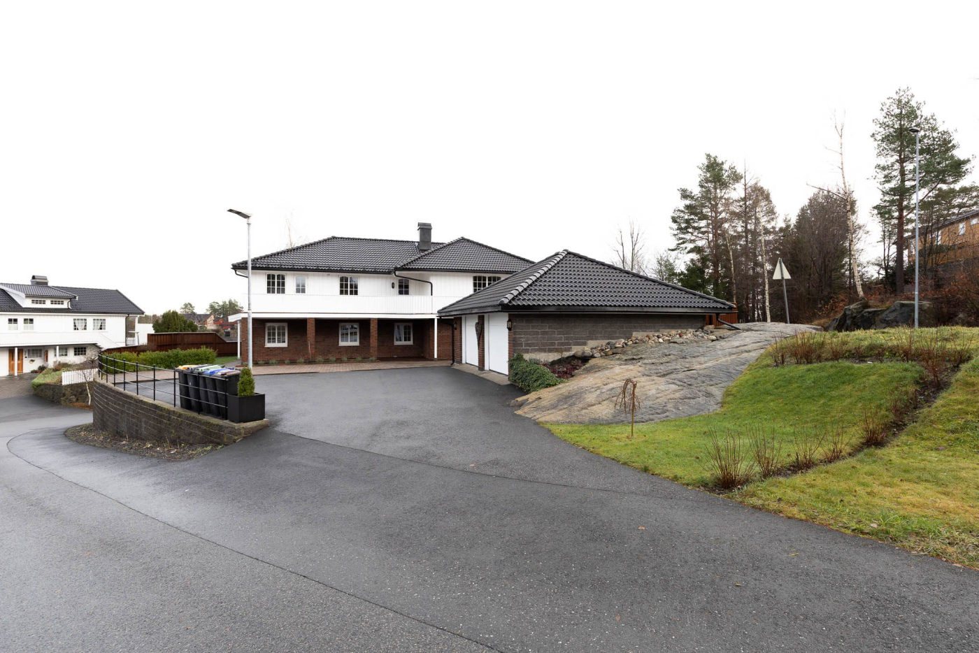 Real estate exterior with dull overcast sky before professional sky replacement editing
